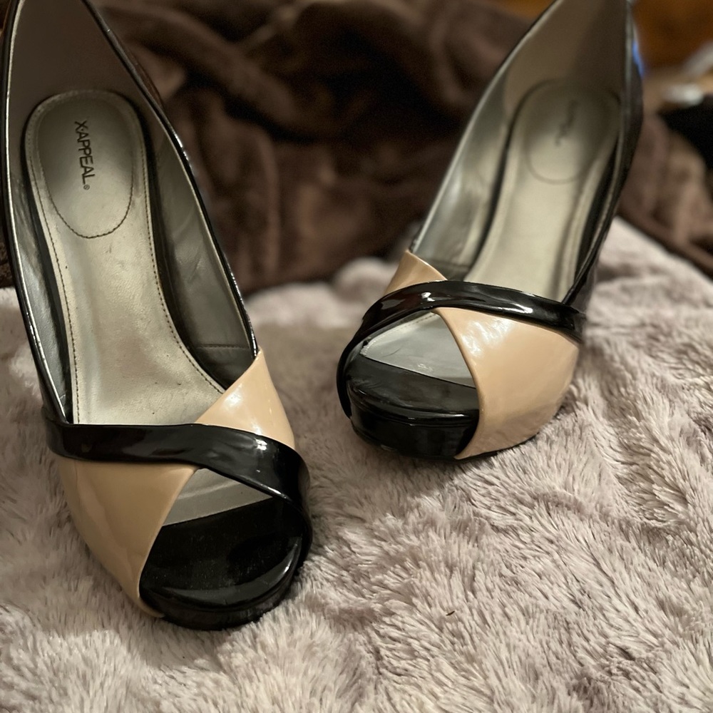 Cream and black patent leather heels.